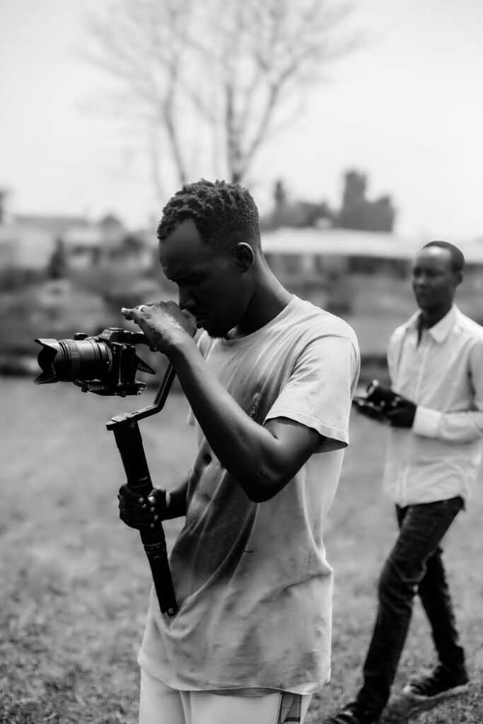 Crafting Captivating Headlines: Your awesome post title goes here Young filmmakers using a camera gimbal for outdoor shooting. Capturing dynamic shots, teamwork in filmmaking.